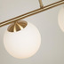Nosh Mahala Deckenlampe mit Stahldetail in Messingausfhrung mit 3 Milchglaskugeln